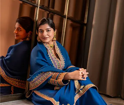Portrait of a woman in a blue embroidered outfit